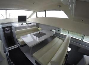 a room with a table and chairs in a boat at Beautiful and magnific yacht in Lisbon