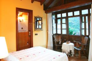 A bed or beds in a room at Casas Rurales Prieto