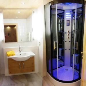 a bathroom with a sink and a shower at Apartment Santnerhof in Virgen