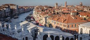 a view of a city with a river and buildings at Hotel Guerrato in Venice