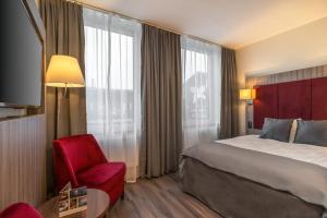 Ένα ή περισσότερα κρεβάτια σε δωμάτιο στο Hotel Oxelösund