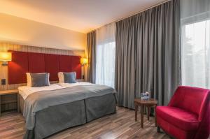 Ένα ή περισσότερα κρεβάτια σε δωμάτιο στο Hotel Oxelösund