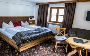 Voodi või voodid majutusasutuse Hotel zum Goldenen Löwen toas