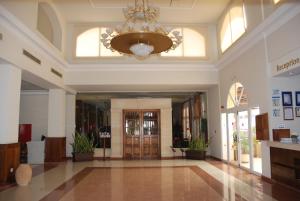 a large lobby with a chandelier in a building at Aktea Beach Village in Ayia Napa +37 photos
