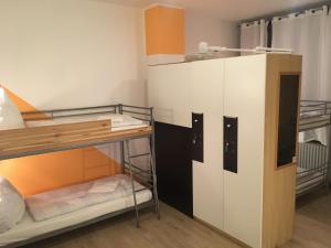 a bunk bed room with two bunk beds at Gästehaus Kaiserpassage- Ihr Cityhostel in Karlsruhe