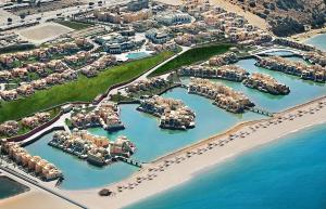 an aerial view of a marina with a resort at The Cove Rotana Resort - Ras Al Khaimah in Ras al Khaimah