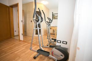 a gym with two exercise bikes in a room at Pleasant Villa Valmonida with Pool, Sauna, Gym and BBQ in Žminj