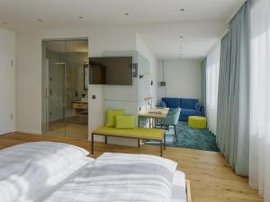 Postel nebo postele na pokoji v ubytování Hotel Federwerk