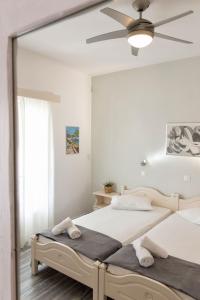 
A bed or beds in a room at Apartments Tarsa
