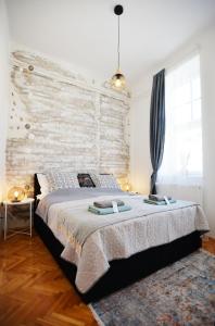 Posteľ alebo postele v izbe v ubytovaní Villa Inda Rooms
