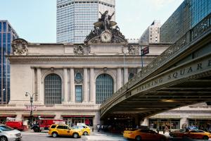 a building with taxis parked in front of it at Hotel Boutique at Grand Central in New York