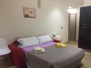 Ένα ή περισσότερα κρεβάτια σε δωμάτιο στο Casa Vacanze Letizia