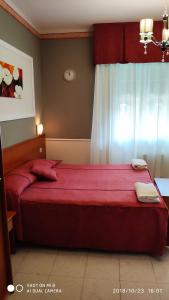 Кровать или кровати в номере Hotel Minerva