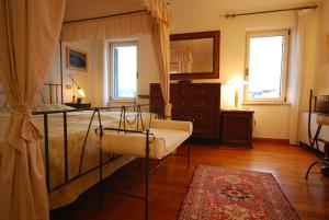 Ein Bett oder Betten in einem Zimmer der Unterkunft Villa Tuttorotto