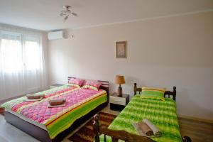Postel nebo postele na pokoji v ubytování Park Apartman
