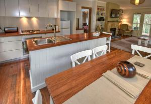 a kitchen with a sink and a wooden counter top at Ribbon Gum Lodge in Katoomba