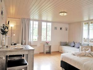 Postel nebo postele na pokoji v ubytování Chalet Maria Interlaken