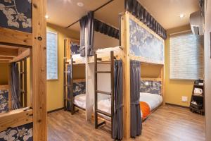Postel nebo postele na pokoji v ubytování IKIDANE Cozy Hotel Haneda Airport