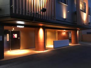 a building with a light on the side of it at Hotel Gaudium (Adult Only) in Kuki