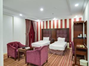 En eller flere senge i et værelse på Elaf Suites Al-Andalus + 24 billeder