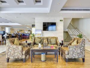 a lobby with couches and a coffee table at Elaf Suites Al-Andalus in Jeddah