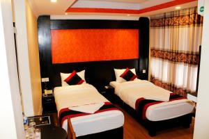 Voodi või voodid majutusasutuse Kathmandu Regency Hotel toas