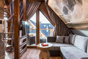 Posezení v ubytování POD SKOCZNIA SPA Zakopane