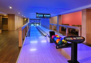 a bowling alley with balls on a lane at Hotel Visegrád in Visegrád +89 photos