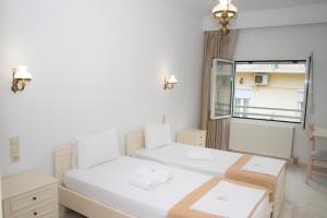 Hotel Astron客房内的一张或多张床位