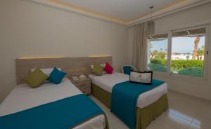 Postel nebo postele na pokoji v ubytování Shams Lodge + 37 fotografií