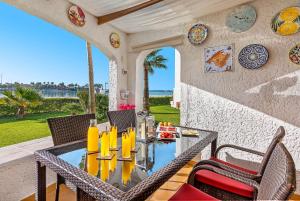 a dining room with a table and chairs on a patio at Apartment Carabela 2 in Alcudia