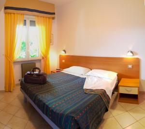 Ліжко або ліжка в номері Residence Sant'Anna