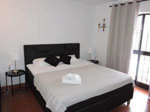 Cama ou camas em um quarto em Nerja Villas-Capistrano