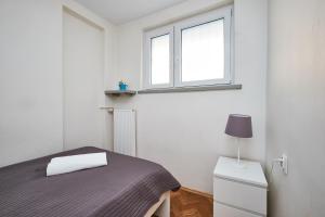 Posteľ alebo postele v izbe v ubytovaní Top Ten House Marszałkowska V