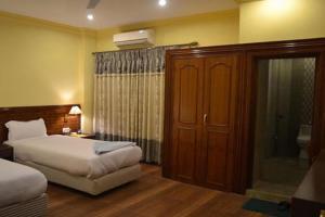 Ліжко або ліжка в номері Hotel The White Lotus View Pvt Ltd