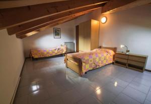 Ένα ή περισσότερα κρεβάτια σε δωμάτιο στο Appartamento Manuela