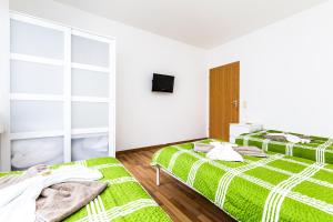 Ein Bett oder Betten in einem Zimmer der Unterkunft Workers Apartment am Wiener Platz