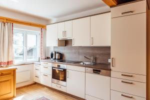 Kuchyň nebo kuchyňský kout v ubytování PRIVATE SUITES
