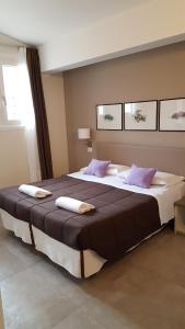 Postel nebo postele na pokoji v ubytování Hotel Arianna