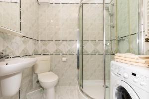 Koupelna v ubytování Jantar Apartamenty - Promenada Kołobrzeg + 50 fotografií