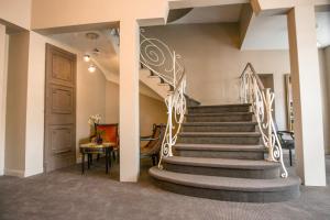 a staircase in a building with a stair case at Hôtel Ligure in Cannes