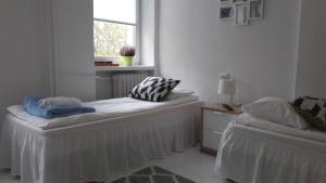 Posteľ alebo postele v izbe v ubytovaní Ogrodowa Apartments