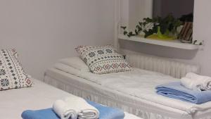 Posteľ alebo postele v izbe v ubytovaní Ogrodowa Apartments