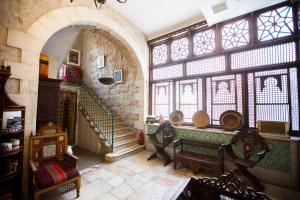 a large room with a staircase and a large window at Jerusalem Hotel in Jerusalem