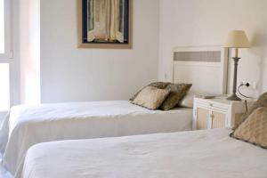 Postel nebo postele na pokoji v ubytování Apartamento Mar de Alborán