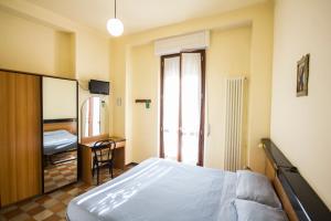 A bed or beds in a room at Albergo Sala
