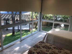 Ένα ή περισσότερα κρεβάτια σε δωμάτιο στο TERRAZA al RIO +34 φωτογραφίες
