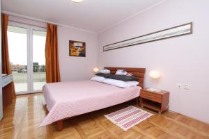 Posteľ alebo postele v izbe v ubytovaní Apartments El Corsaro