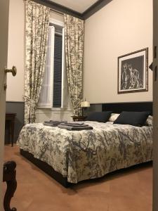 Postel nebo postele na pokoji v ubytování Luigi in Palazzo Bianchi