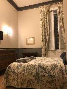 Postel nebo postele na pokoji v ubytování Luigi in Palazzo Bianchi